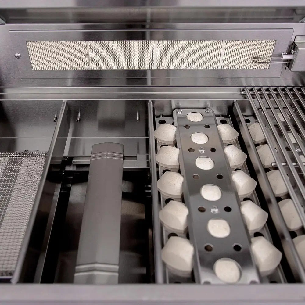 Close-up of Summerset grill interior with ceramic briquette flame tamers and stainless burners