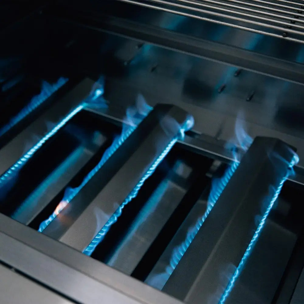 Blue flame burners inside Summerset stainless steel built-in gas grill