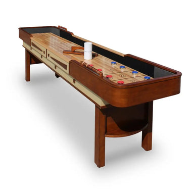 Angled view of Hathaway Merlot 9-foot shuffleboard table with play accessories, showcasing traditional pub-style design in cherry and maple wood.