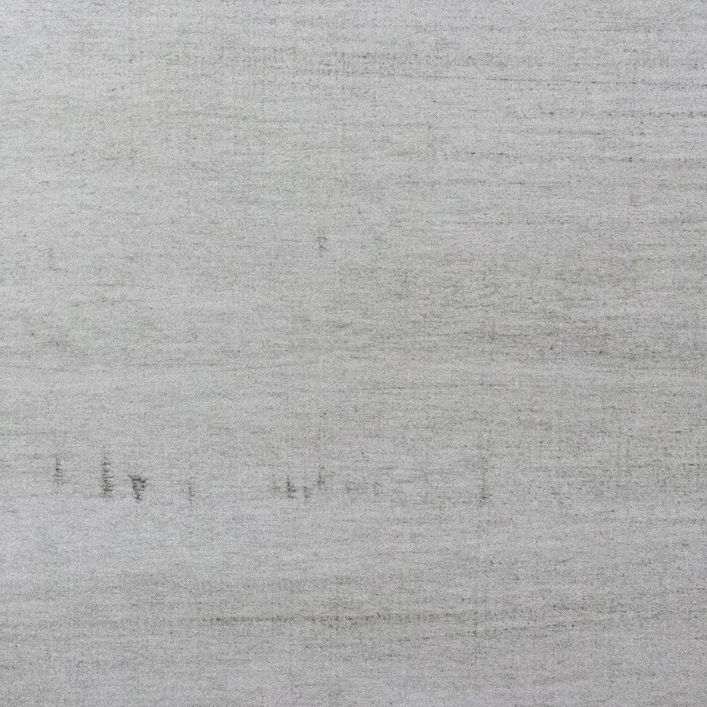 Zoomed-in view of smooth driftwood-style finish with light gray wood tones, used for a modern farmhouse foosball table design.