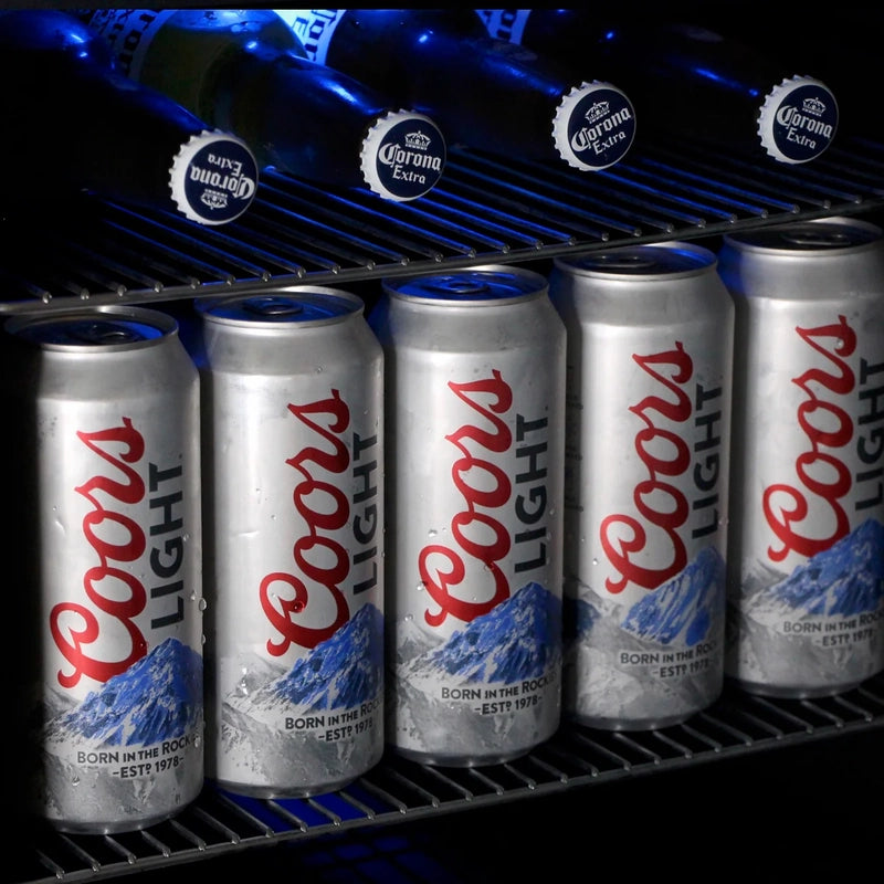 Close-up view of bottles and cans stored inside the KingsBottle KBU28LRX beverage cooler, showcasing organized storage of Coors Light cans and Corona Extra bottles.
