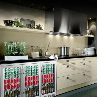 KingsBottle KBU328M beverage fridge built into a modern kitchen setup, fully stocked with drinks.