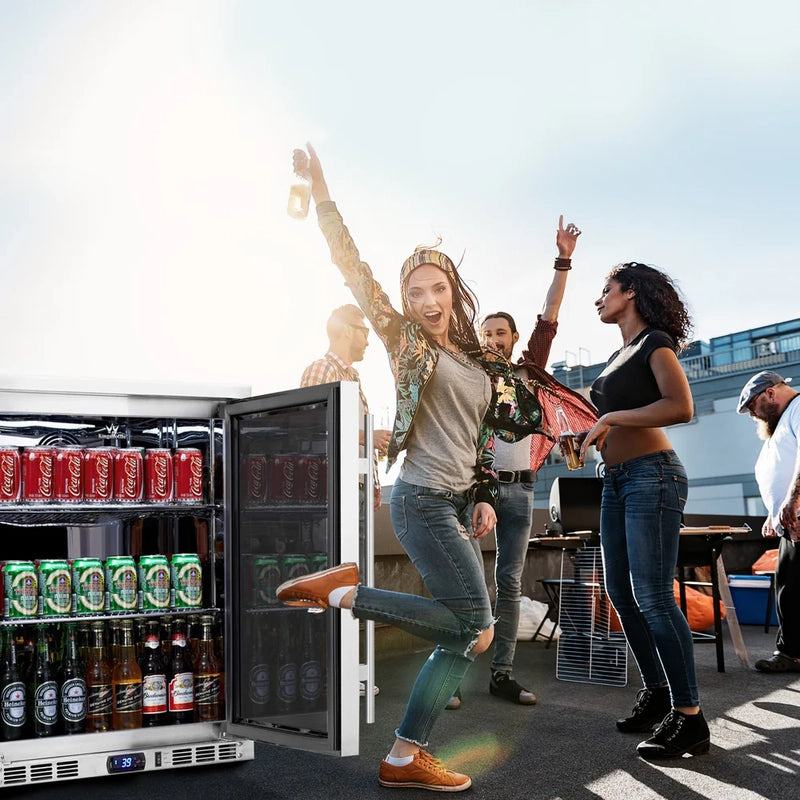 KingsBottle KBU55M beverage fridge in outdoor lifestyle setting with people enjoying a party.