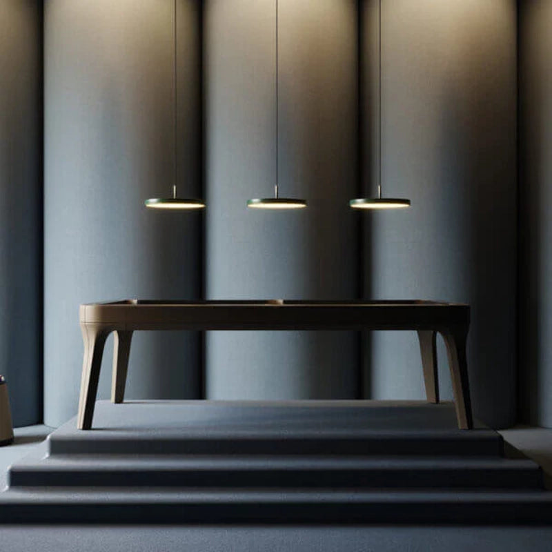 Modern White Billiards Morris pool table in matte black finish showcased on an elevated platform under pendant lighting