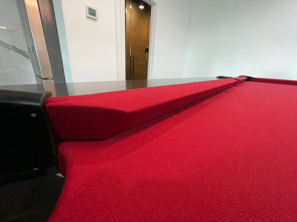 Corner detail of White Billiards Neavio pool table with rich red felt