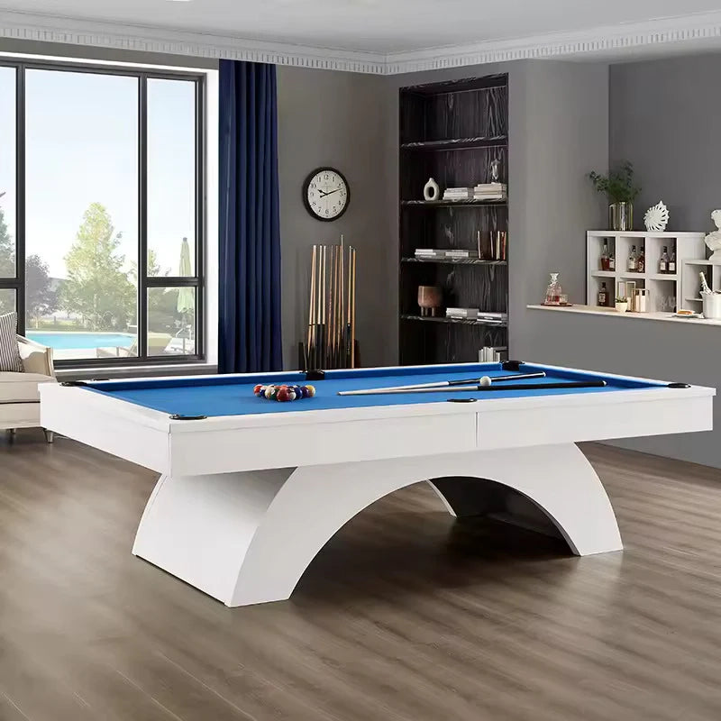 Side view of White Billiards Karmen pool table showcasing sleek white arc base and vibrant blue playing surface