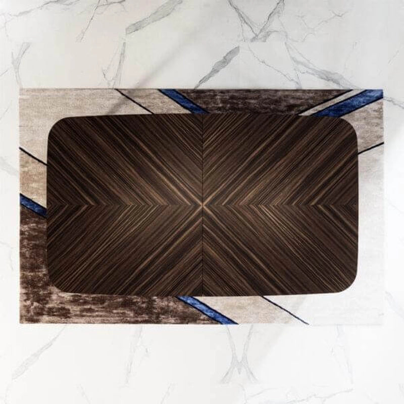 Top-down view of White Billiards Morris billiards table with decorative walnut dining cover on geometric rug