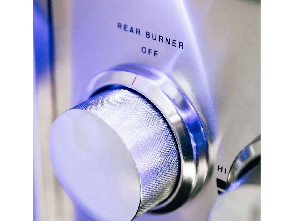 Close-up of stainless steel control knob for rear burner on outdoor grill.