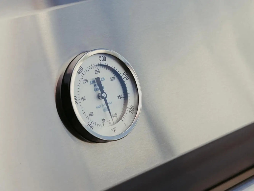 Built-in grill thermometer showing temperature in Fahrenheit and Celsius