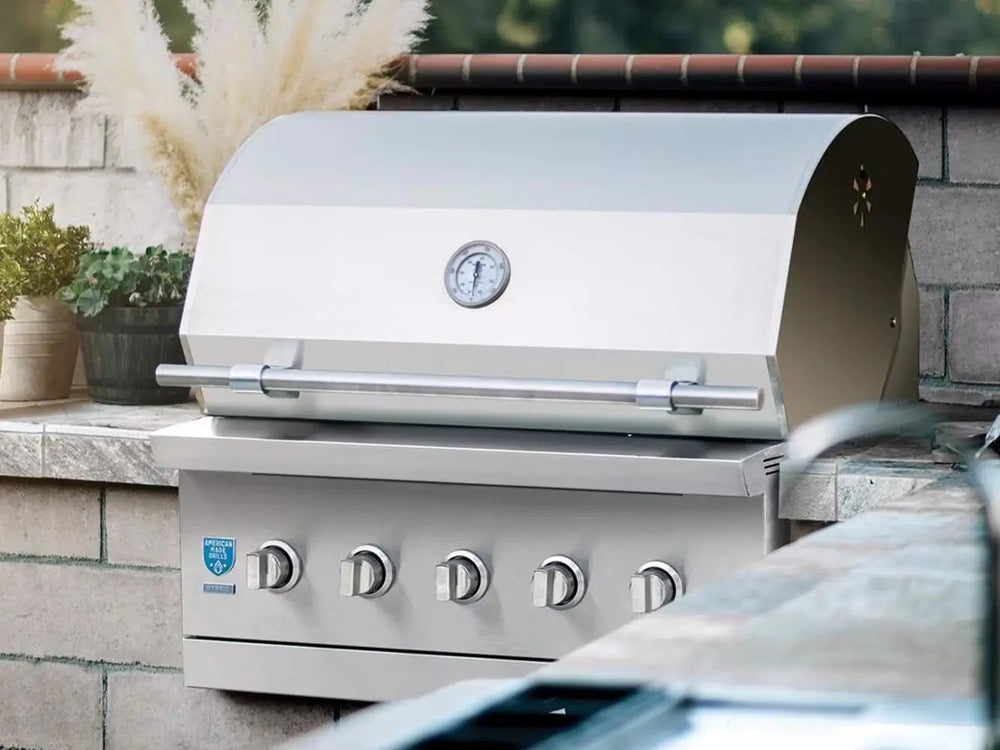 Luxury outdoor built-in stainless steel grill with closed hood and control knobs