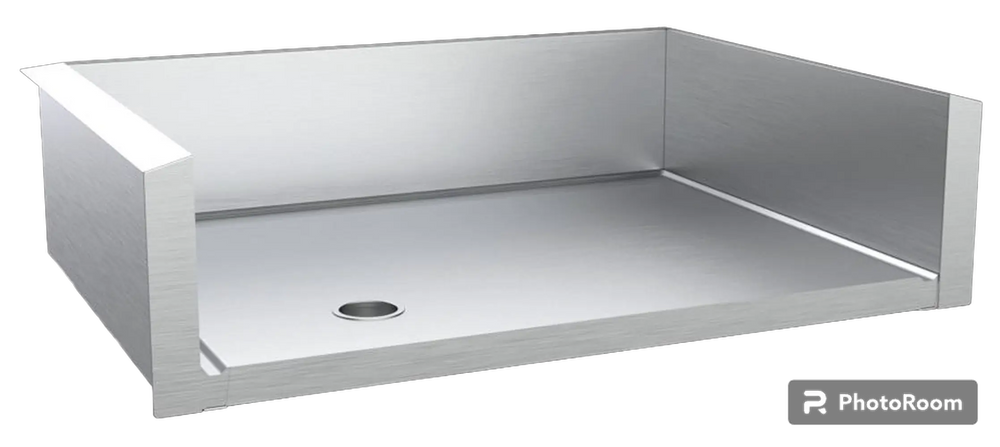 Angled view of stainless steel drop-in griddle liner with rear and side splash guards