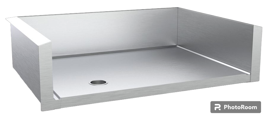 Angled view of stainless steel drop-in griddle liner with rear and side splash guards