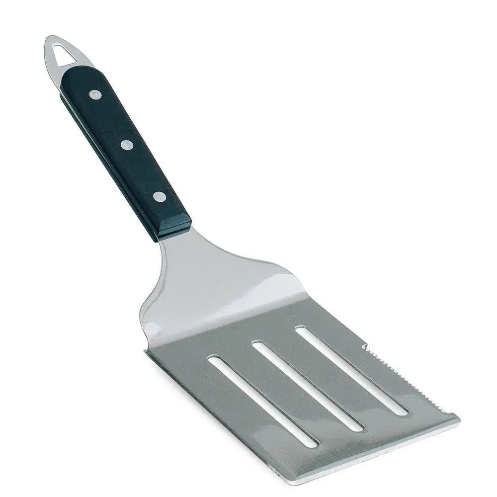 Summerset stainless steel slotted spatula with serrated edge from the SSTOAK-1 pizza oven accessory kit.
