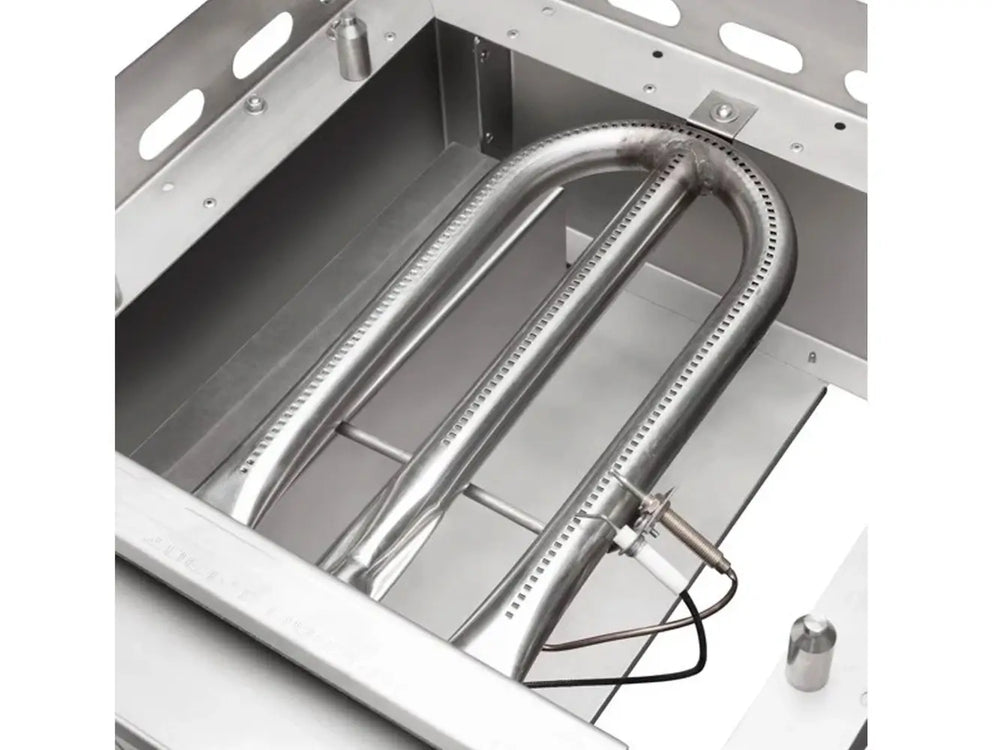 Close-up of stainless steel U-shaped gas burner inside Le Griddle outdoor gas griddle