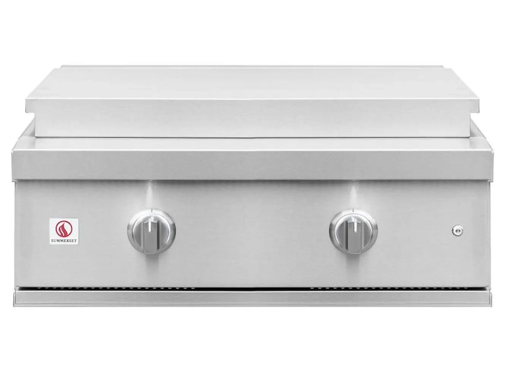 Stainless steel flat top griddle with closed cover and front-facing control knobs