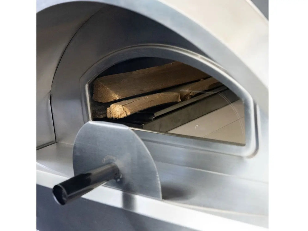 Inside view of Summerset hybrid pizza oven with wood fuel loaded on tray