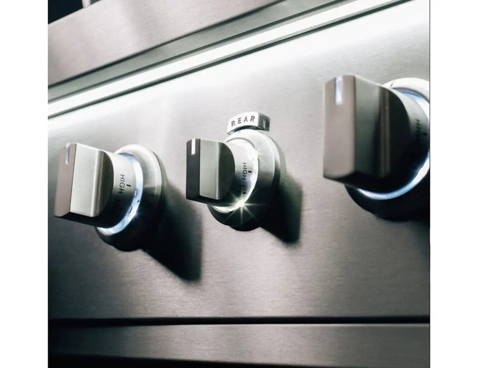 Three stainless steel grill control knobs with LED backlighting in blue.
