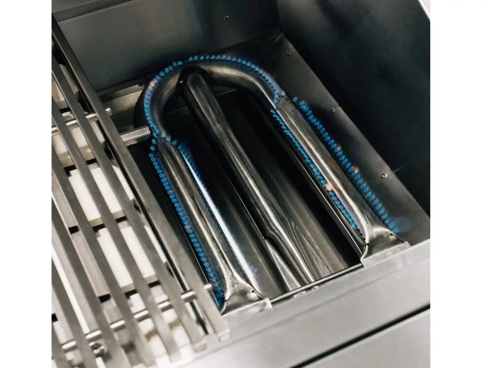 Stainless steel U-shaped gas burner with blue flames beneath grill grates.