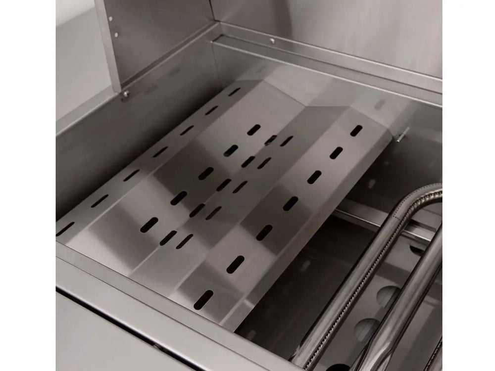 Heat deflector and burner layout inside stainless steel outdoor grill firebox.