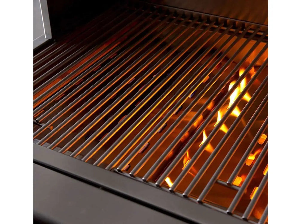 Close-up of grill cooking grates with flames below for high-heat searing.