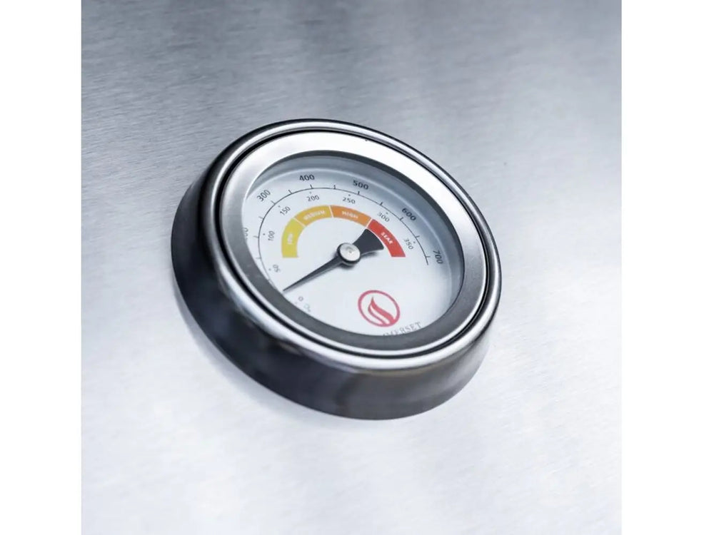 Built-in stainless steel grill temperature gauge displaying heat levels.