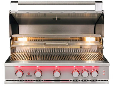 Front view of True Flame built-in gas grill with lid open, five red LED-lit knobs, halogen interior lighting, and full stainless steel cooking grates.