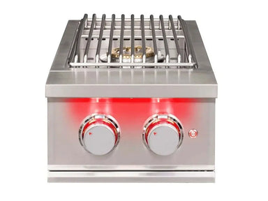 Top view of True Flame power burner showing stainless steel grates, brass burner, and two red LED-lit knobs.