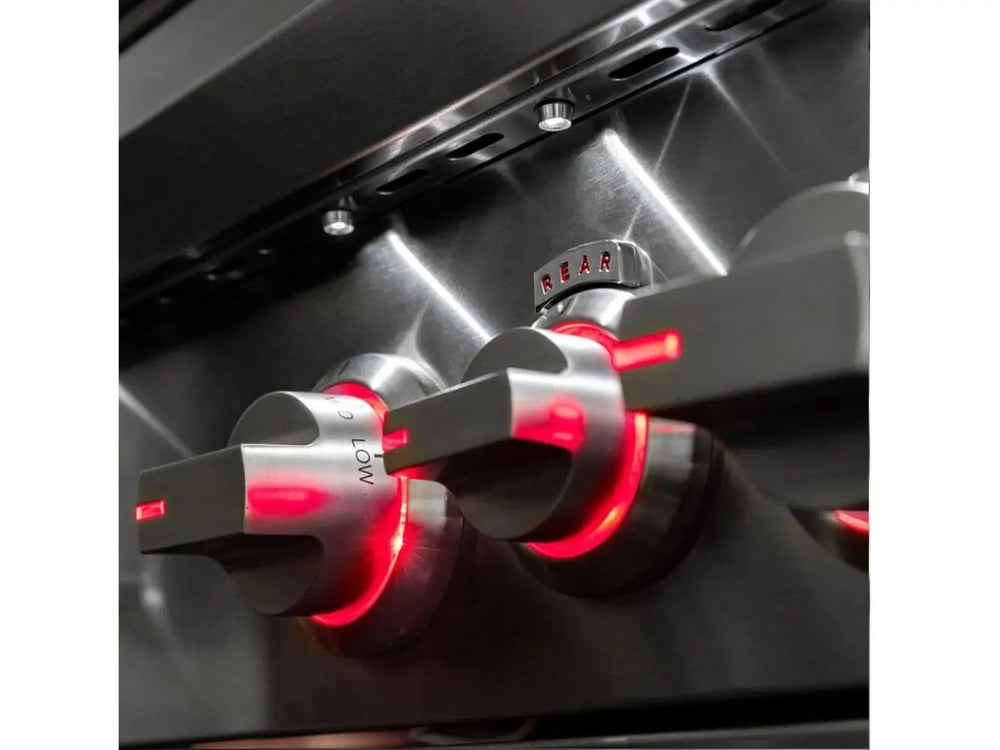 Stainless steel grill control knobs illuminated with red LED lighting for precise heat control.