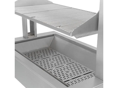 Adjustable Santa Maria grill grate lifted above firebox with perforated heat plates for even wood-fire distribution