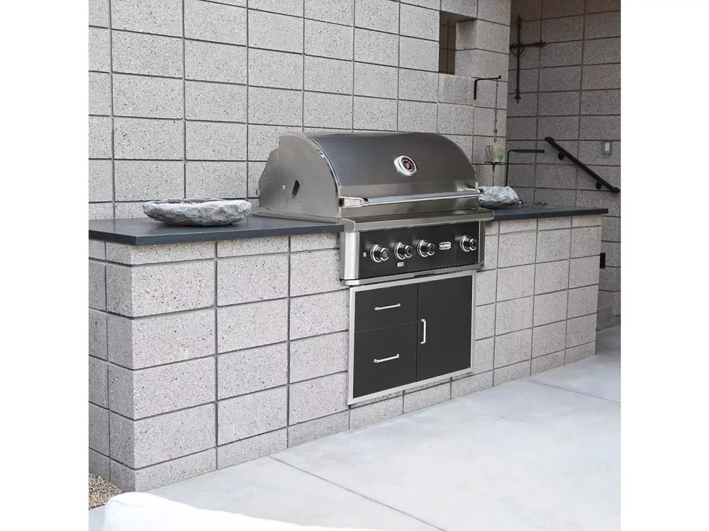 Wildfire 36-Inch Built-In Gas Grill with closed hood, installed in modern outdoor kitchen setup