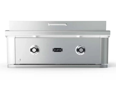 Wildfire Ranch Pro 30-Inch 304 Stainless Steel Built-In Griddle featuring a sleek, polished front panel with dual control knobs and a centered logo, designed for high-performance outdoor cooking in luxury kitchens.
