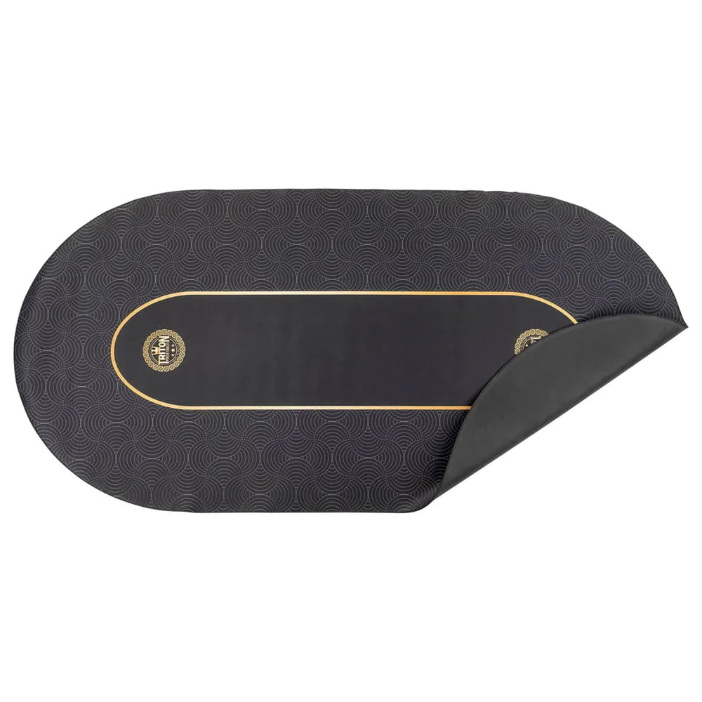 Black Triton poker table felt mat with gold trim, patterned surface, removable backing, and centered poker table logo.
