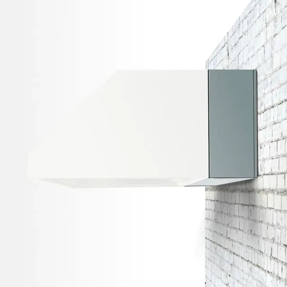 TrueFlame 8" stainless steel spacer bracket on outdoor vent hood, mounted on brick wall.