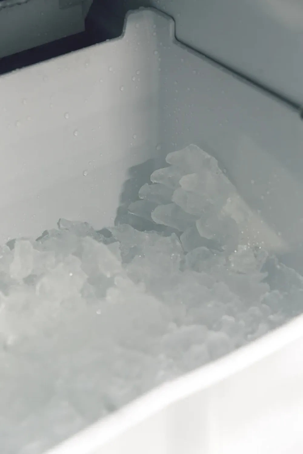 Detail shot of fresh clear ice cubes collected in the storage bin of a Summerset IM-15.