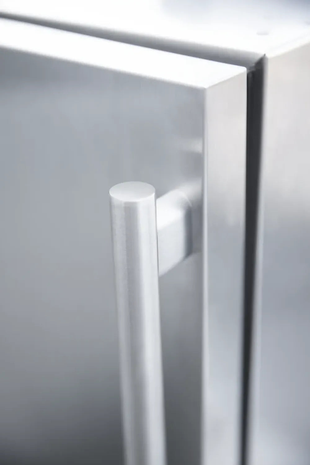 Close-up of the heavy-duty stainless steel vertical handle on a Summerset outdoor appliance.