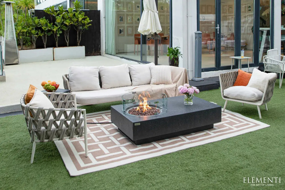 Elementi Metropolis fire pit featuring a side control panel and a matching dark grey concrete propane tank hideaway.