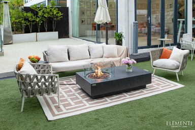 Elementi Metropolis fire pit featuring a side control panel and a matching dark grey concrete propane tank hideaway.