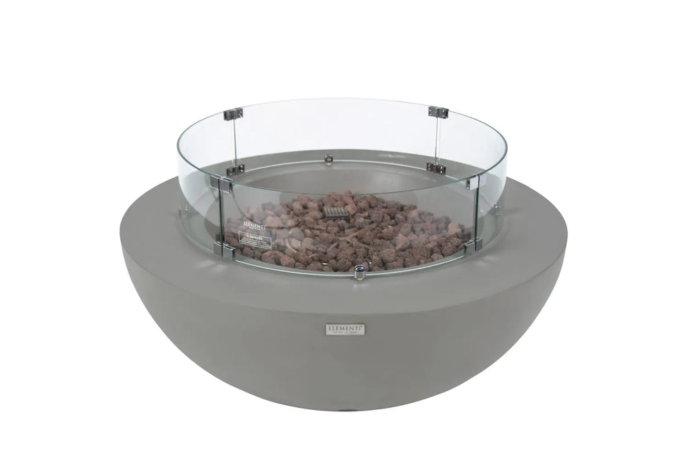 Clear tempered glass circular wind guard installed on an Elementi Lunar Bowl fire pit.