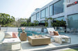 Modern outdoor living space featuring the Uluru rectangular fire pit table and designer seating.