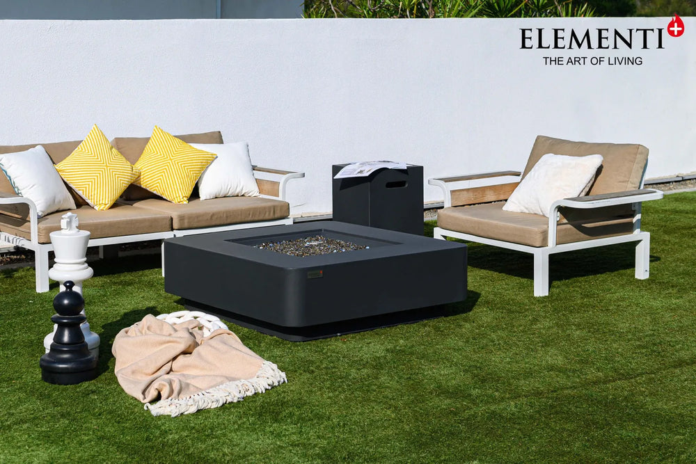 Elementi Plus Bergamo OFG419DG dark gray fire table in outdoor lounge with cushioned seating.