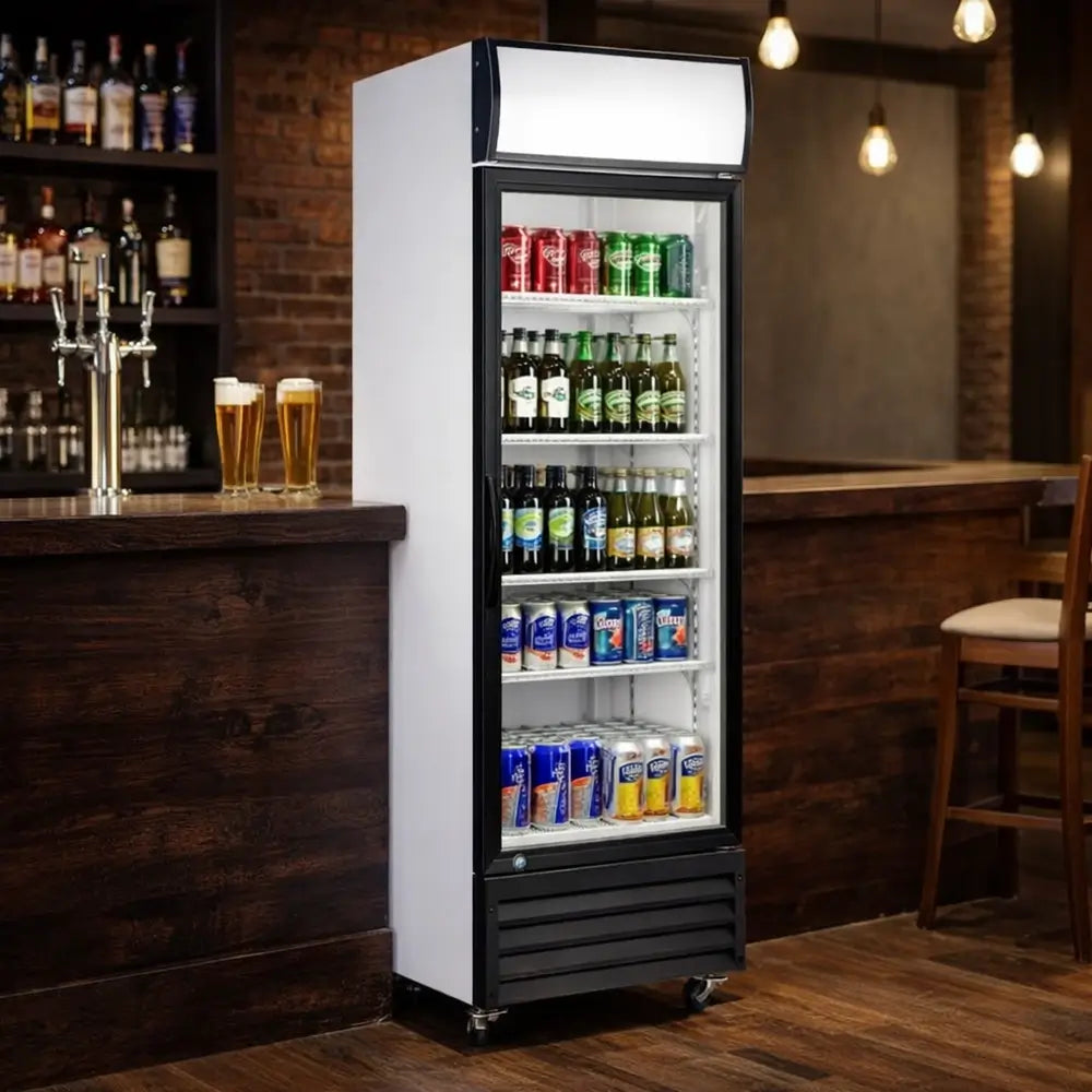 KingsBottle G380 upright display merchandiser refrigerator stocked with beverages in a dimly lit bar setting.