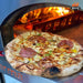 Artisan pizza baking in WPPO Karma 42 wood-fired oven with open flame, melted cheese, pepperoni, and vegetables.