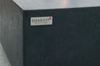 Macro detail of Bergen fire table handcrafted slate black GFRC stone finish.