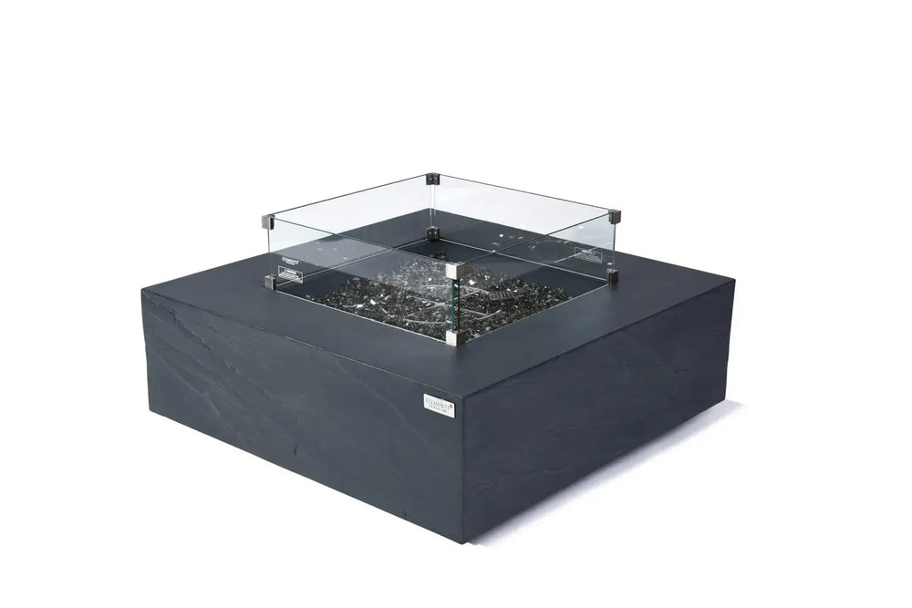 Close-up of Roraima fire table glass wind guard and slate black GFRC texture.