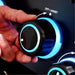 Detail view of the blue LED backlit Sensi-Touch control knob on a Broil King Baron 420 Shadow gas grill.
