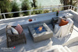 Elementi Plus OFG413LG Victoria space gray fire table on a luxury patio.