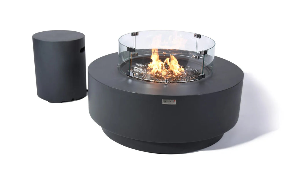 Elementi Plus Nimes dark gray fire table with glass wind guard and propane tank cover.