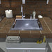 Sunstone stainless speed rail shelf mounted below outdoor sink, holding towels and soap, heavy-duty pocket shelf storage.