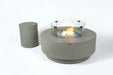 Elementi Plus Colosseo OFG414LG light gray fire table with glass wind guard and matching propane tank cover.