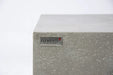 Elementi logo badge on light gray concrete-style fire table corner.